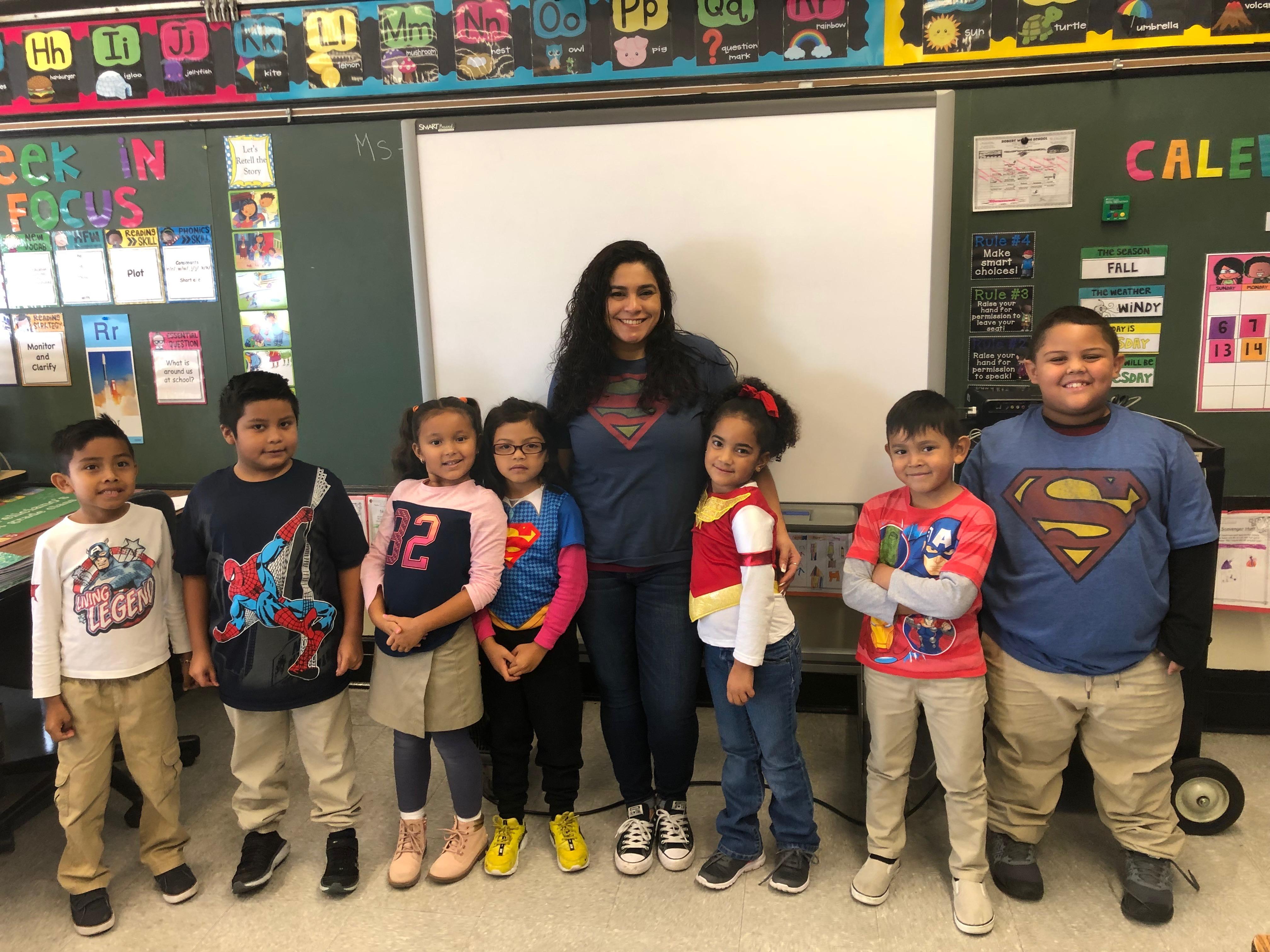 teacher with her class wearing super hero tshirts