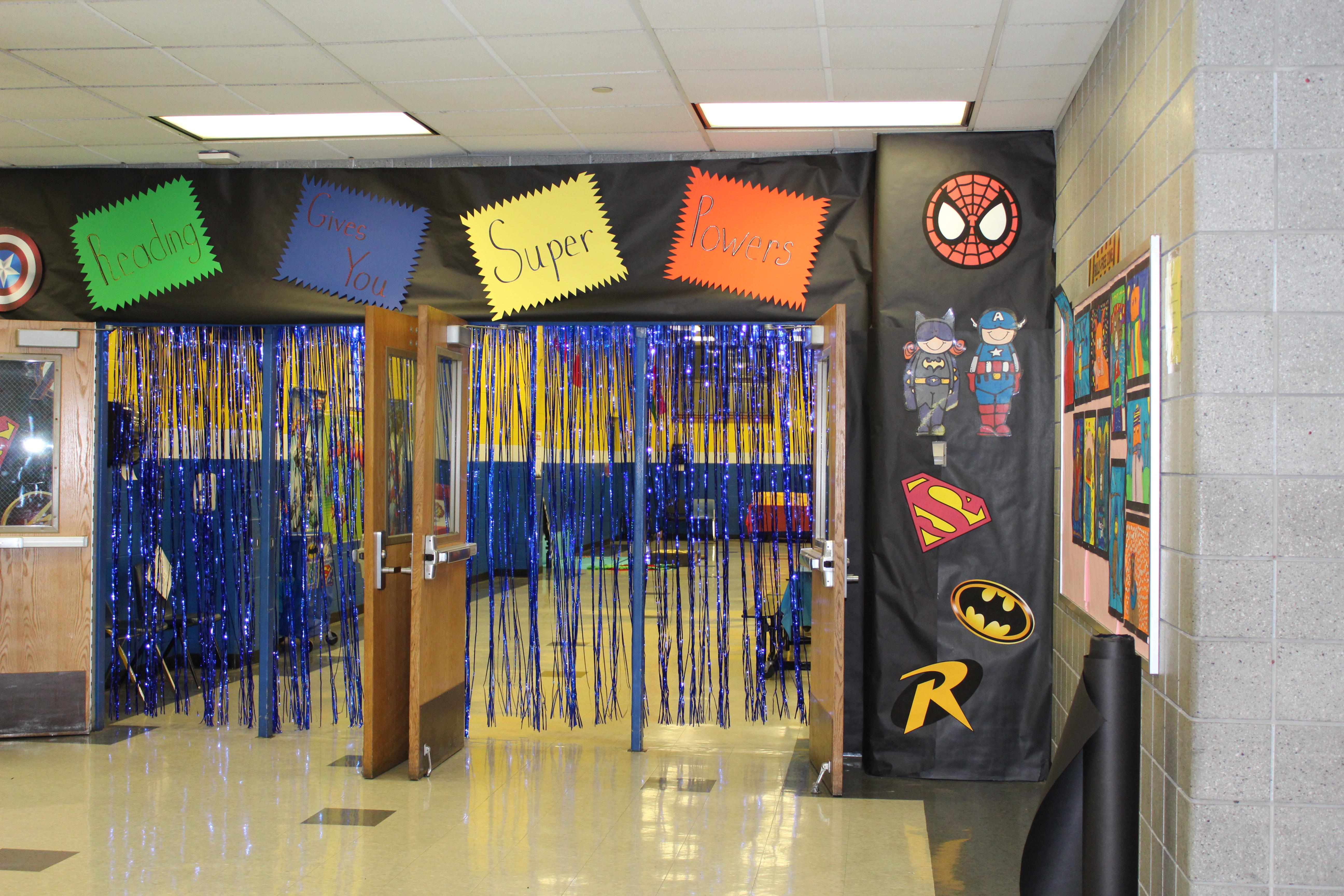Cafetorium Entryway decorated with superhero symbols and string